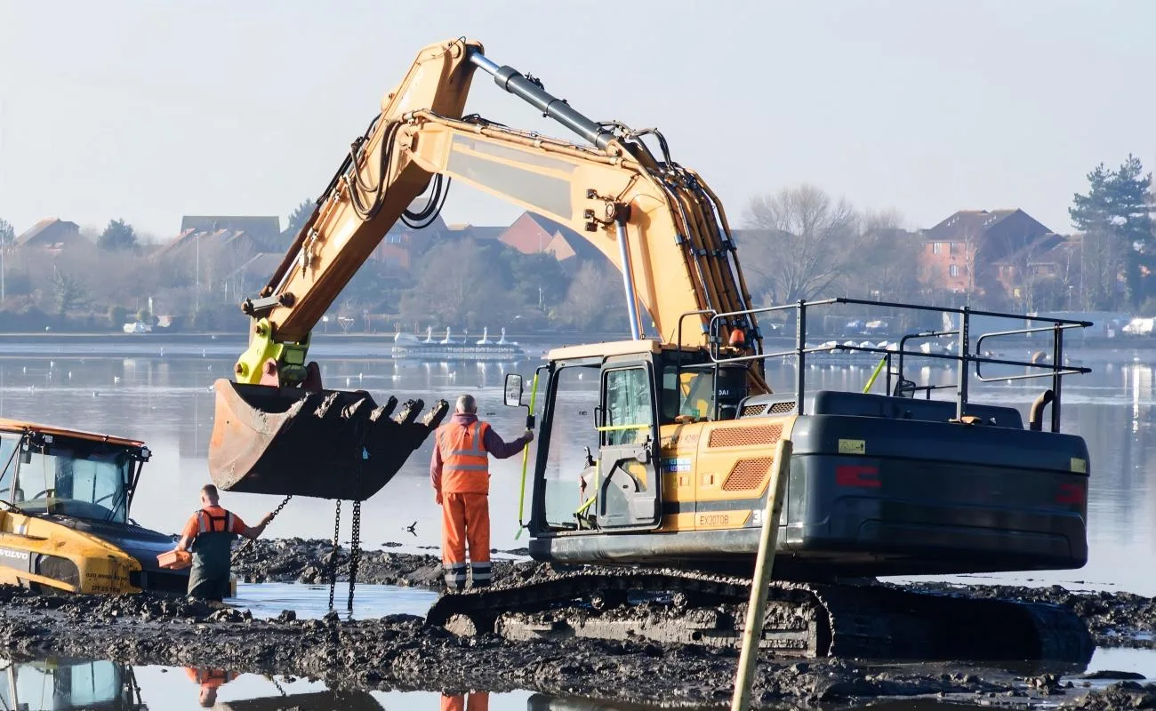 excavator undercarriage in mud